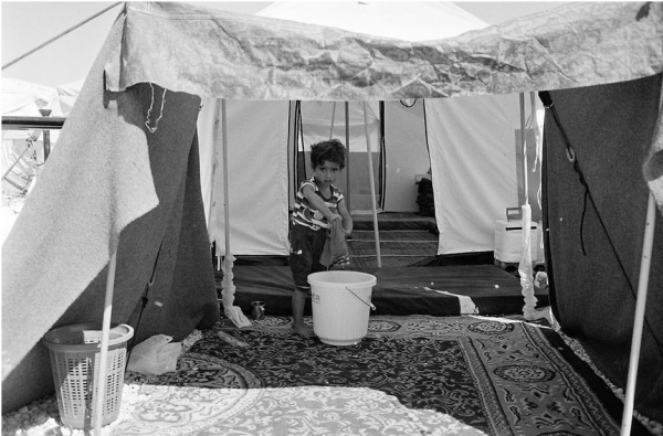 Un enfant dans un camp de réfugié en Turquie. Crédit : François Razon