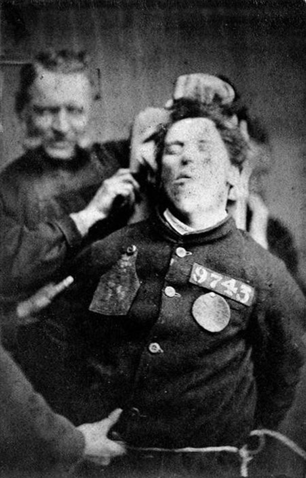 An-insane-asylum-patient-restrained-by-warders-Yorkshire-1869-Henry-Clarke