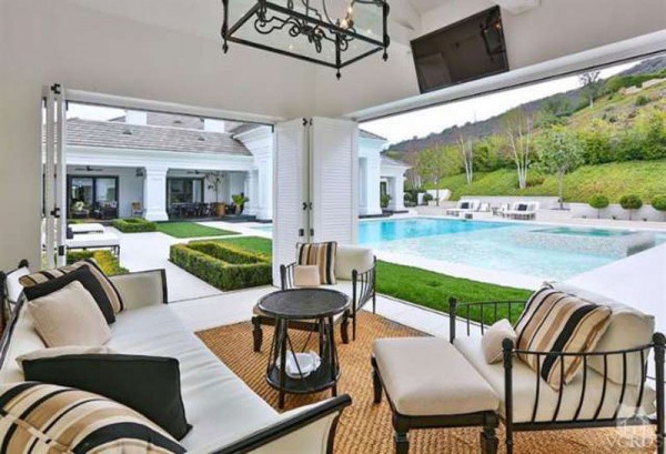 a-lounge-area-adjacent-to-the-pool