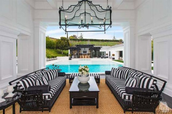 a-patio-with-a-picturesque-view-of-the-pool