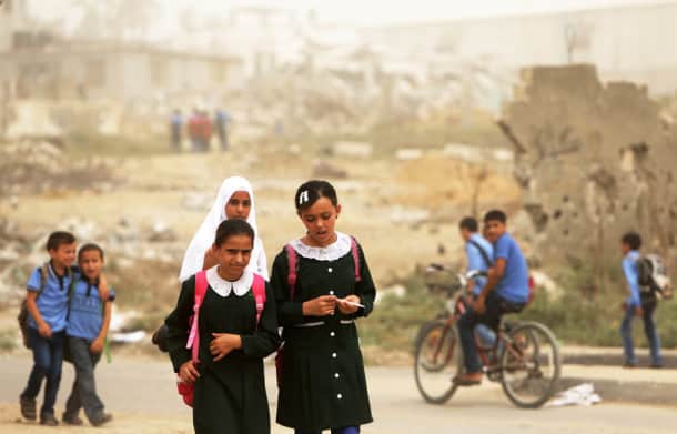 Palestinian school girls walk during a sandstorm in Gaza City on September 9, 2015. A dense sandstorm engulfing parts of the Middle East left at least eight people dead and hundreds suffering from respiratory problems, as officials warned residents to stay indoors. AFP PHOTO / MAHMUD HAMS (Photo credit should read MAHMUD HAMS/AFP/Getty Images)