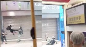manifestant violant coup de pied policier