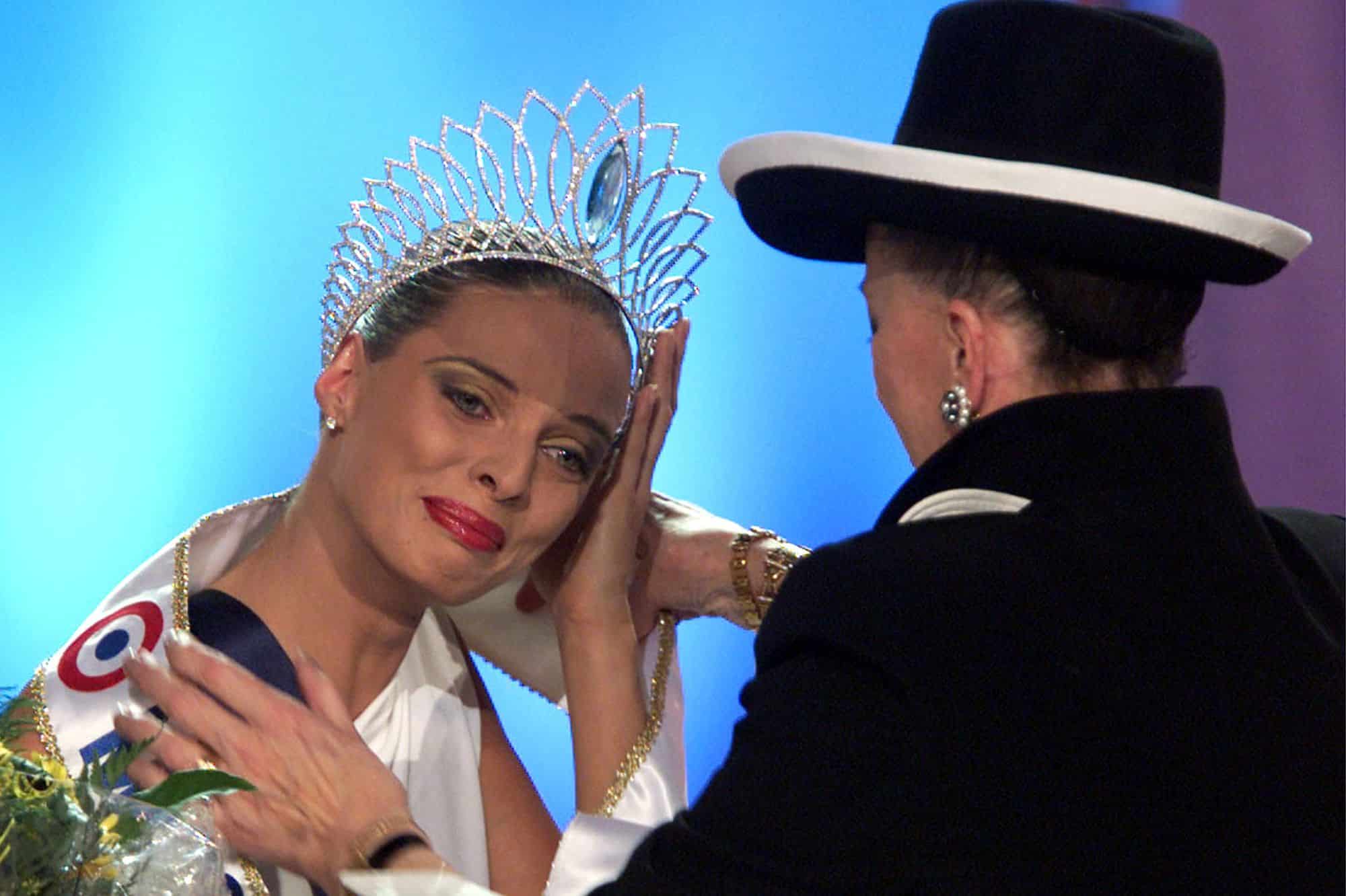 Sylvie Tellier (L) sheds tears of joy while Miss France commitee President Genevieve De Fontenay cro..