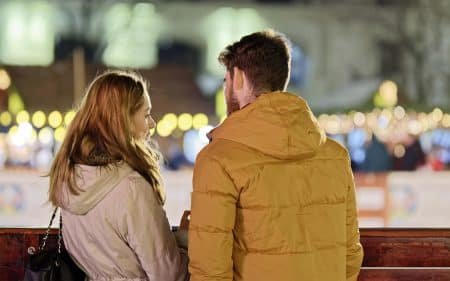 merry christmas, couple, young people, people, blonde, friendship, together, talking, fence, winter, holiday, lights, ornaments, decoration