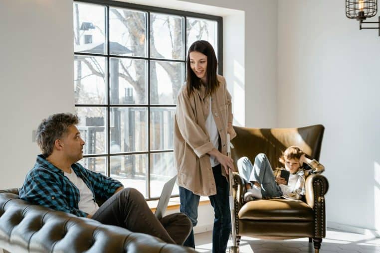 Happy family spending quality time in the living room with natural light.