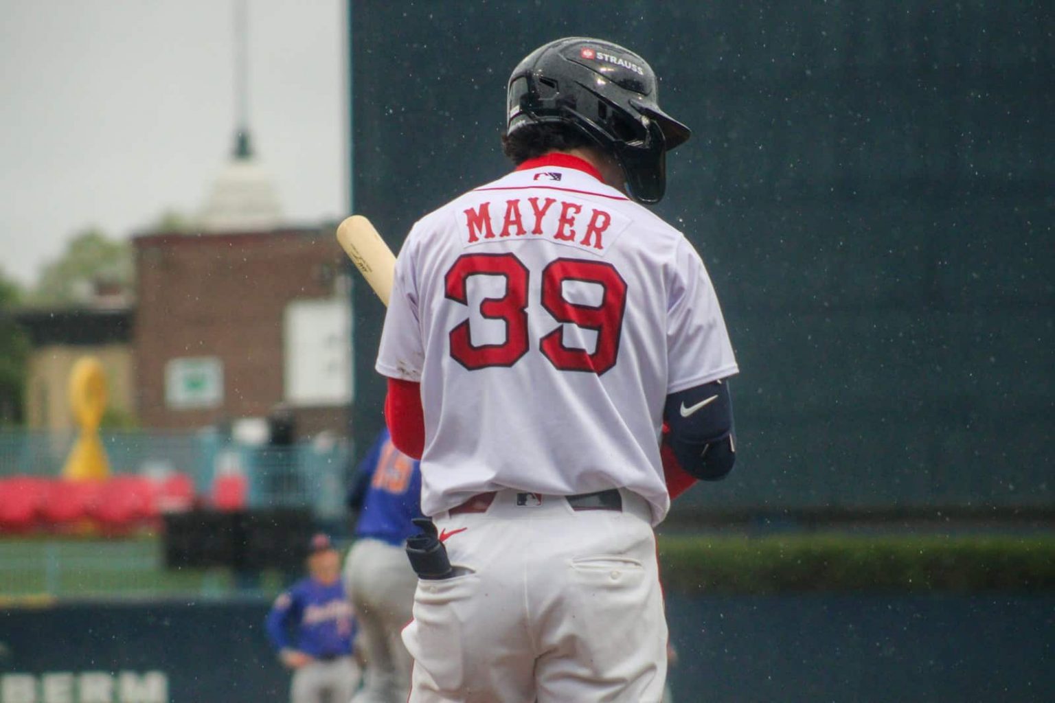 Baseball player mayer, number 39, awaits his turn.