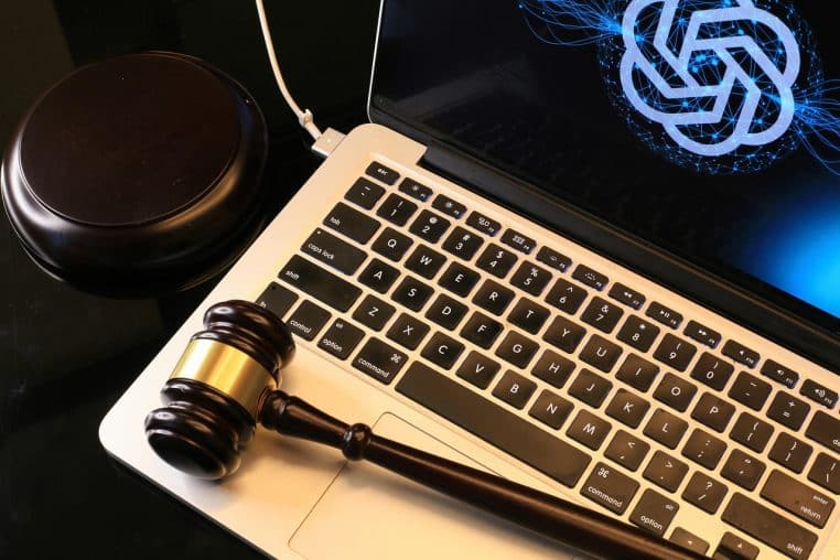 Gros plan sur un ordinateur portable montrant une interface d’intelligence artificielle générative ouverte sur un bureau de travail.