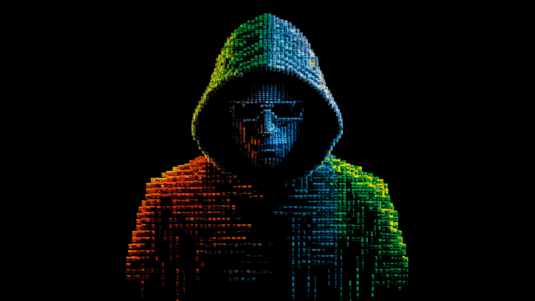Illustration d’un hacker encapuchonné face à un ordinateur, symbolisant les cybercriminels qui tentent de pirater les comptes de messagerie.
