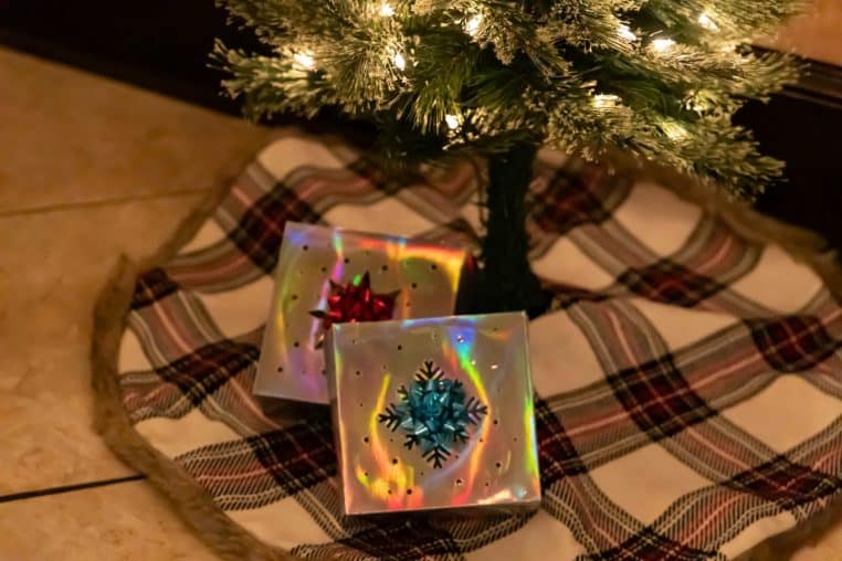 a tree with a gift wrapped gift wrapped gift wrapped around it