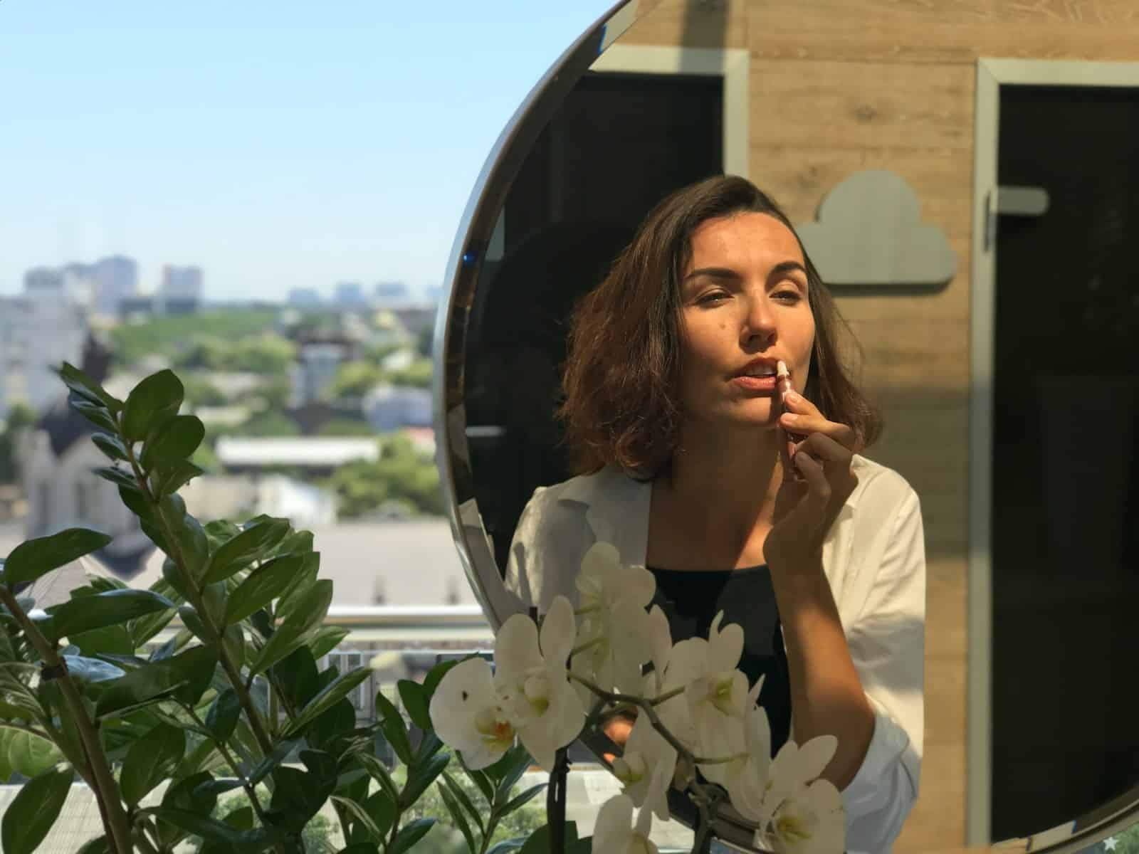 a woman holding a flower