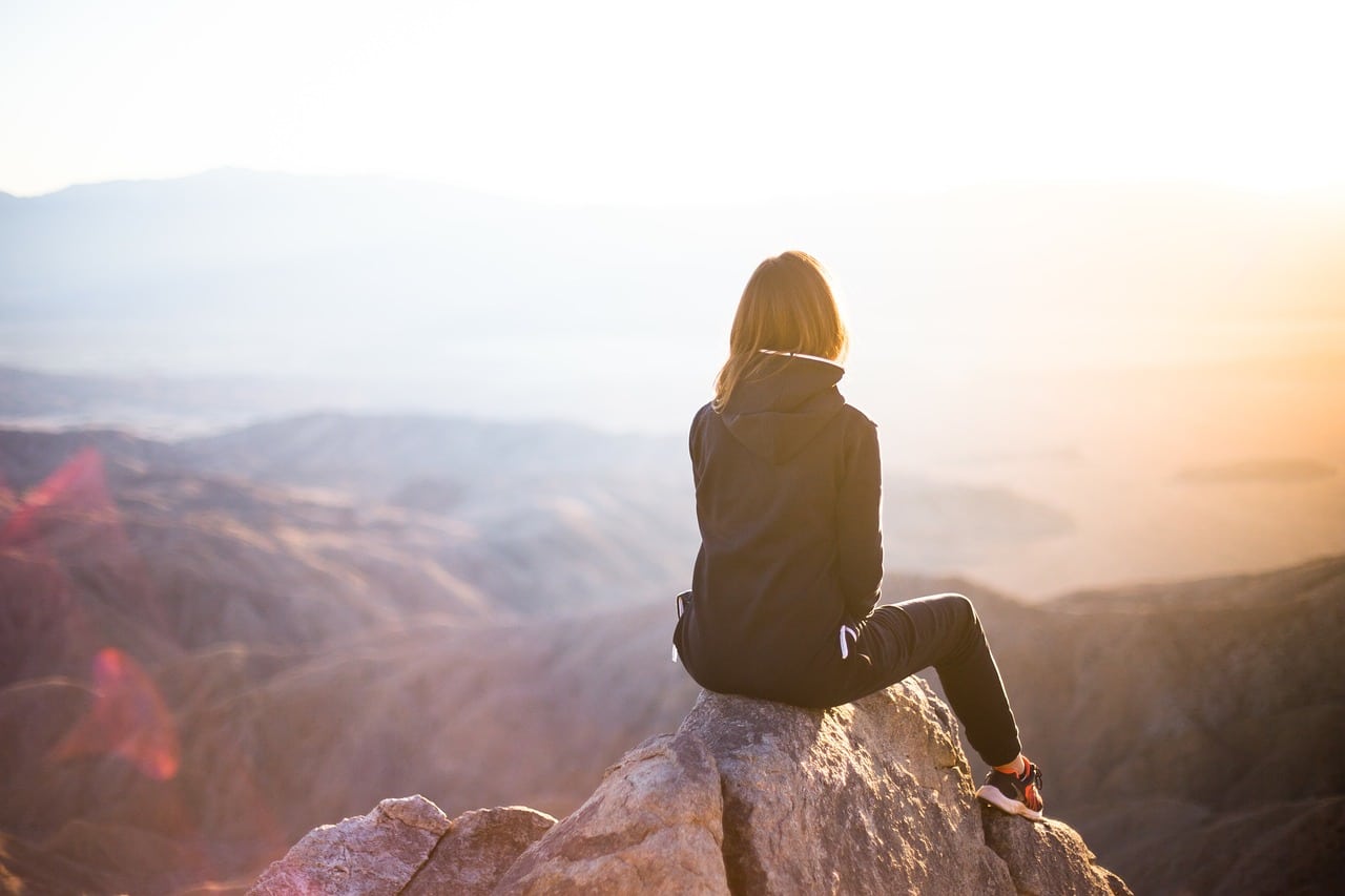 people, woman, travel, nature, adventure, trek, mountain, rock, sunset, cliff, black, hoodie, jacket, alone, thinking, freedom