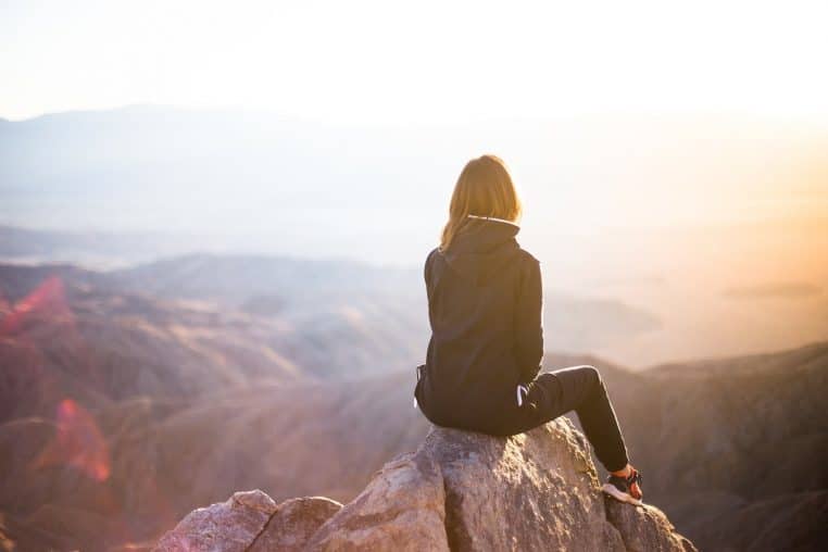 people, woman, travel, nature, adventure, trek, mountain, rock, sunset, cliff, black, hoodie, jacket, alone, thinking, freedom